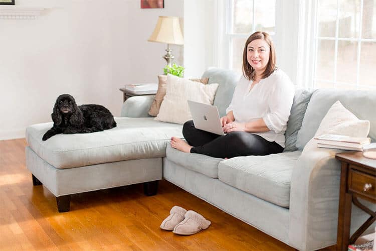 Racheal Cook with her dog working from home