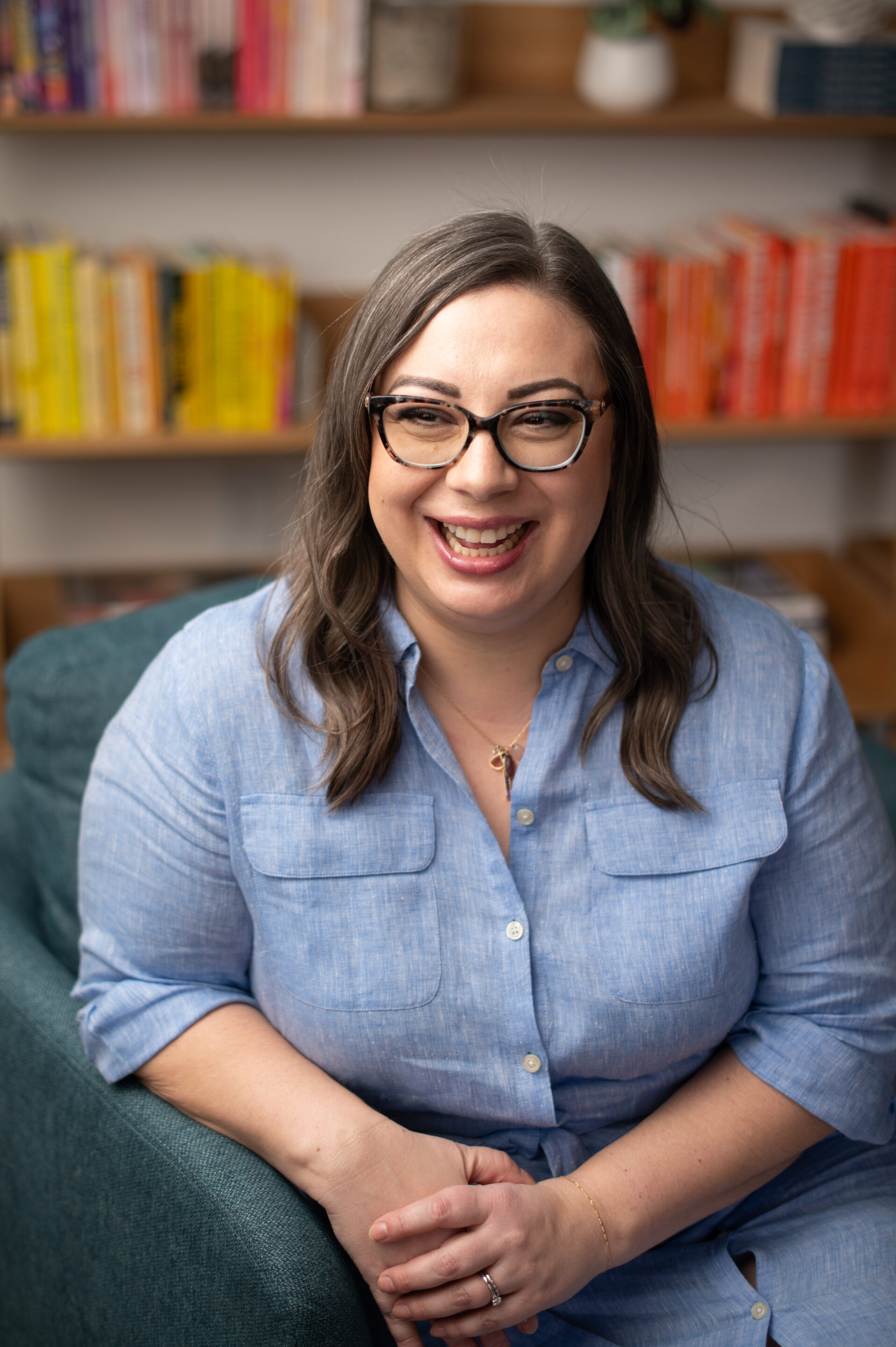 Racheal BYE Headshot Racheal is smiling while at a desk with a laptop